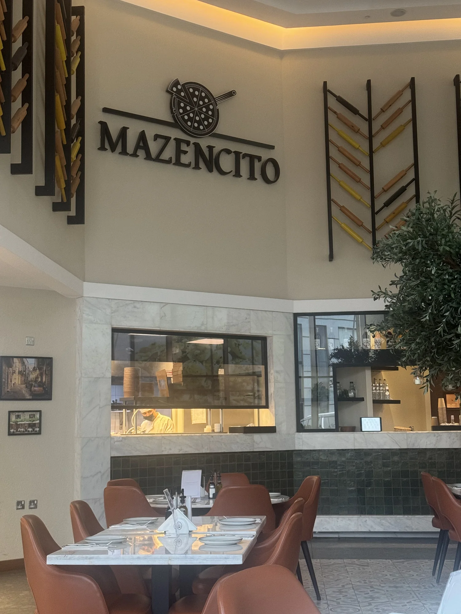 Mazencito Pizzeria dining room with arched wall niches