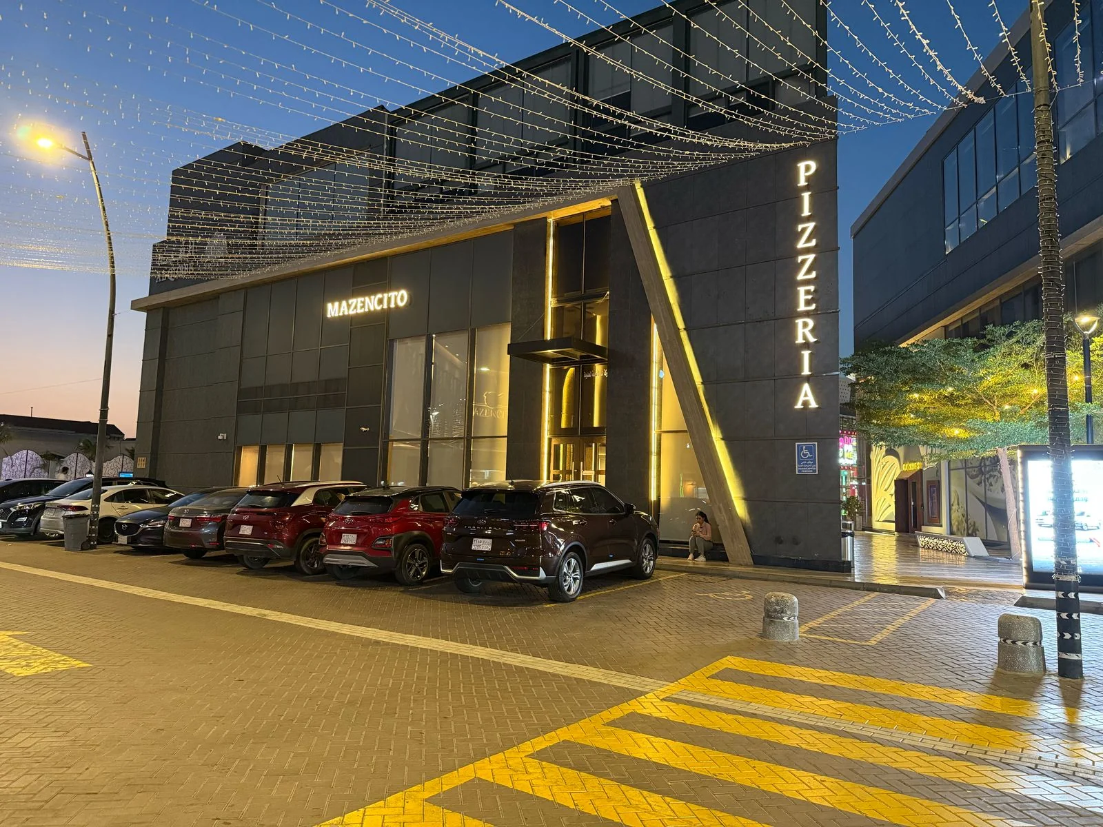 Mazencito Pizzeria building exterior in the evening