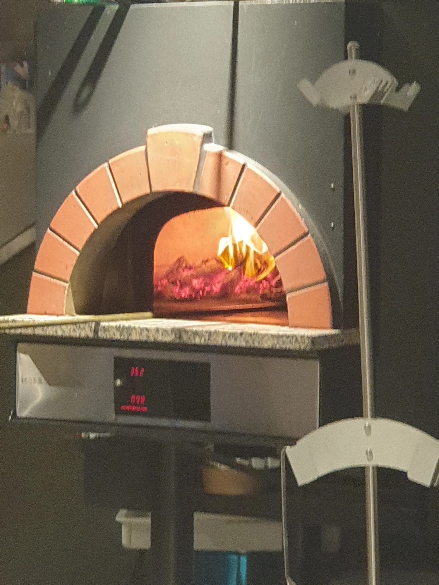 Glowing wood-fired pizza oven
