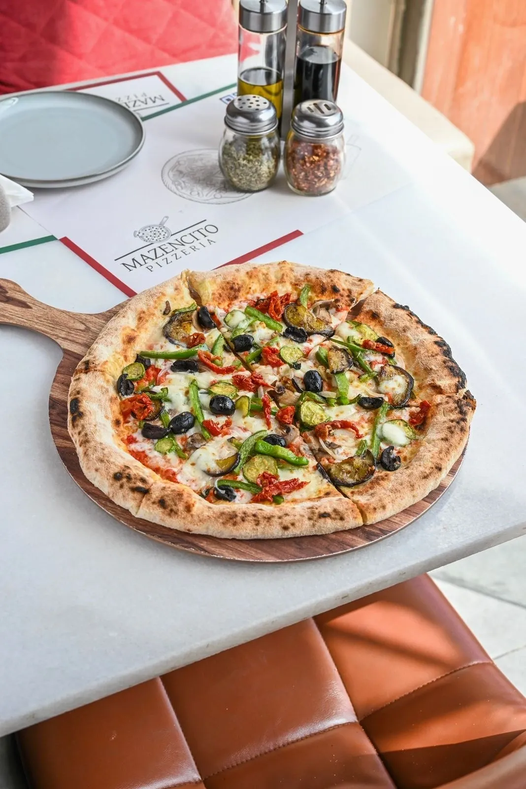 Wood-fired vegetable pizza at Mazencito Pizzeria