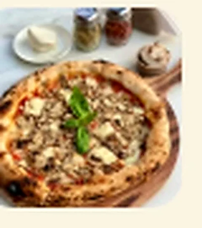 Funghi pizza topped with fresh mushrooms