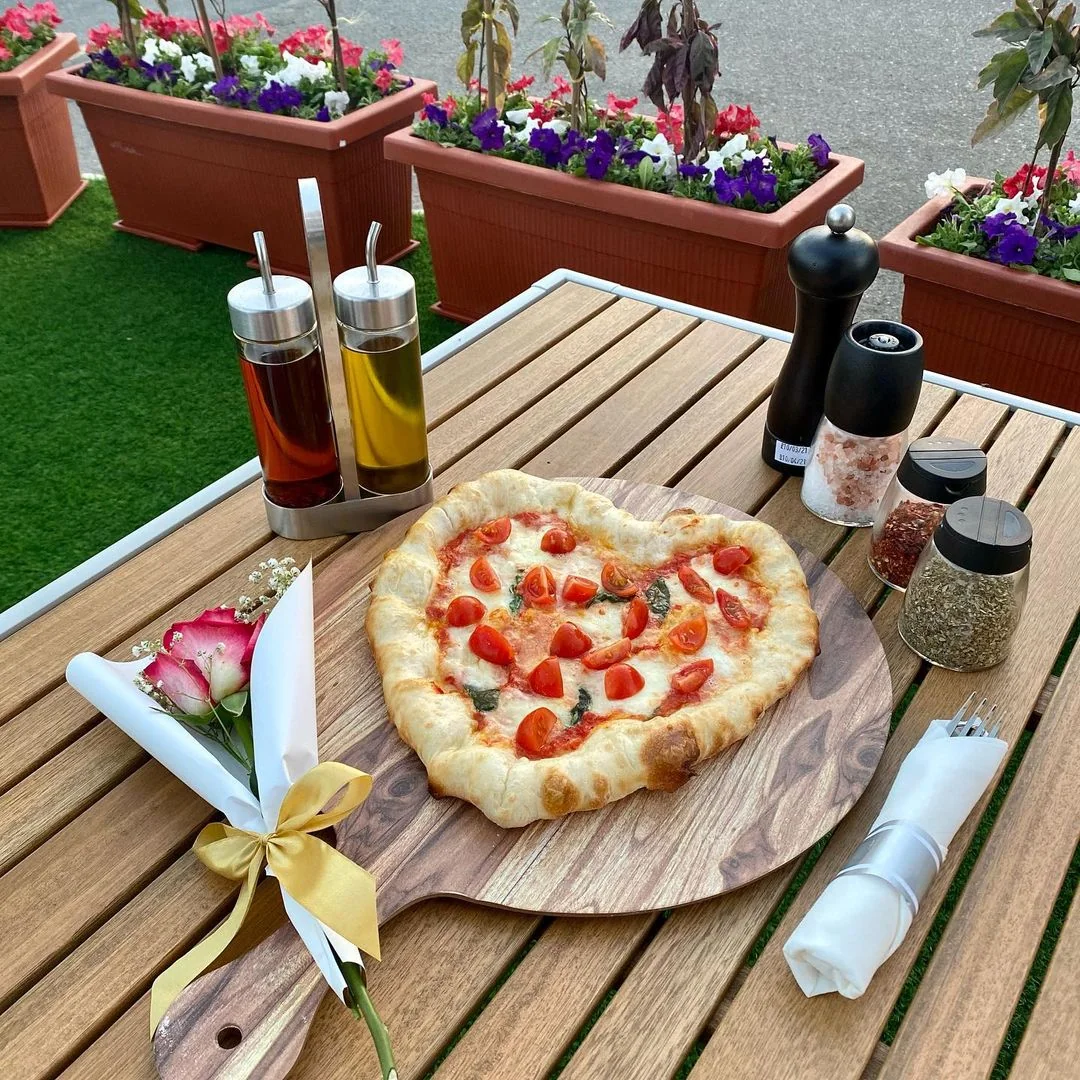 Heart-shaped pizza set for a special celebration